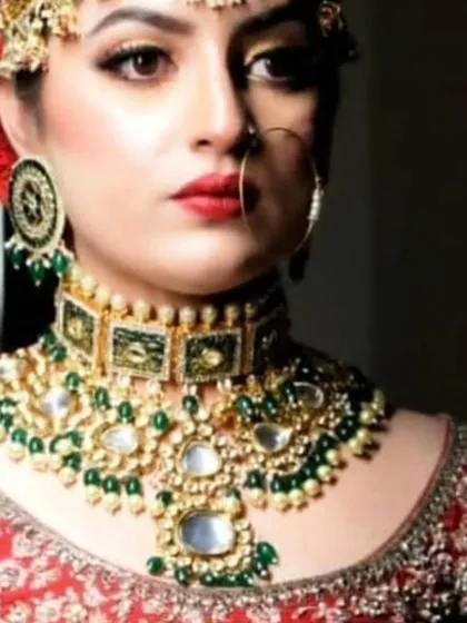A close-up of a unique choker with green enamel and large uncut stones. This is a perfect piece for a bride looking for something special.
