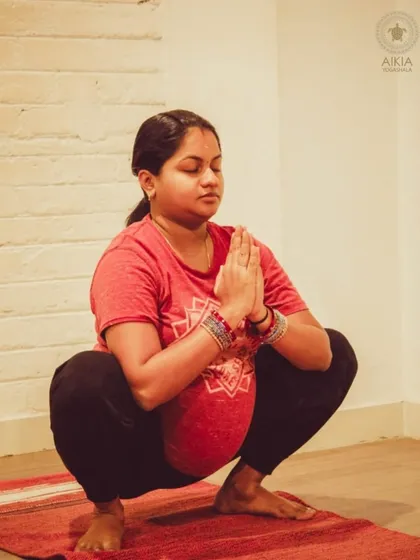 We support mothers through every stage of their journey. This moment from our prenatal yoga class captures the serenity and strength of an expecting mother in Malasana (Garland Pose). Our sessions are designed to nurture both mother and baby, preparing the body and mind for childbirth.