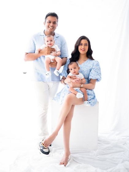 Double the fun with this beautiful family of four! Capturing portraits with twins is always an adventure, and the joy in this photo is just contagious.