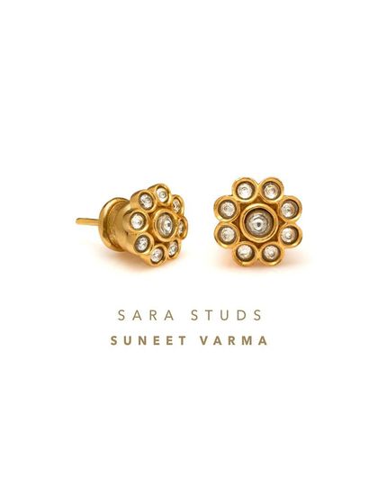 The Sara Studs by Suneet Varma are a miniature masterpiece inspired by the Pakeezah Danglers. These delicate floral studs are adorned with glistening white stones for a touch of sparkle.