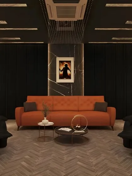 A modern home theater with a cozy, lounge-like feel. The design includes a comfortable sofa, recliner armchairs, and a dark, moody color palette to enhance the viewing experience.