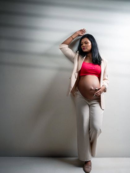 A portrait that speaks of power, grace, and resilience. This mom-to-be's strong pose and confident gaze tell a story of strength and individuality.