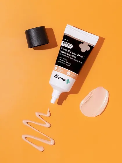 This flatlay is all about the swatch. We created a playful, squiggly line of the tinted sunscreen next to a perfect dab, showing both the texture and the product in use. The orange background adds a warm, sunny feel.