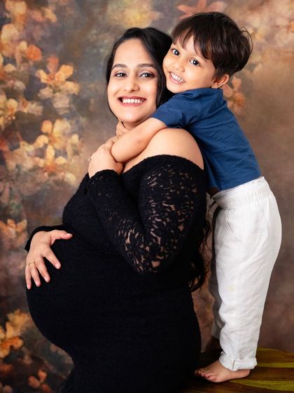 The sweetest hug from a future big brother. Capturing the bond between a mother and her firstborn before the new baby arrives is such a special, heartwarming moment. His love for his mom and the baby is so clear.