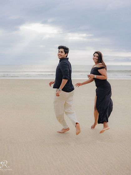 A playful glance back at the camera while running on the sand. This shot feels spontaneous and full of personality, a perfect example of a real moment captured.