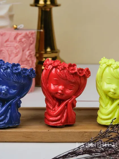 A trio of my Jesmonite figurine holders in vibrant blue, red, and lime green. They look wonderful grouped together as a colorful decor statement.