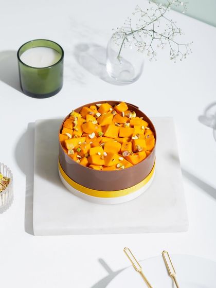 Mango magic in the form of our chocolate-collared mango cake.