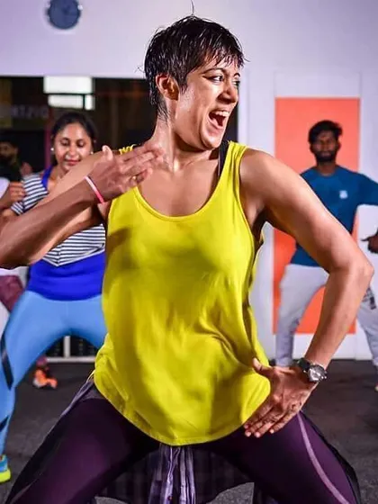 This is me in my element, leading a high-energy Zumba fitness session. My focus is on making every move fun and accessible, so you can feel the music and forget you're even working out. This is what pure joy and passion for dance looks like.