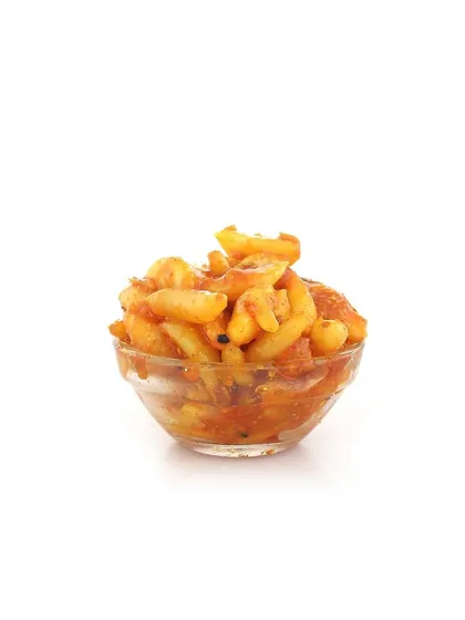 A small bowl of our Lehsun ka Achaar. This garlic pickle is a favorite for its bold and savory flavor.