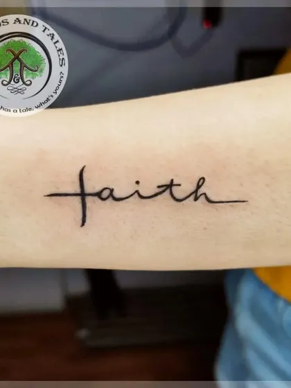 A simple yet powerful "faith" script tattoo. This is a classic choice for a first tattoo, carrying a message that remains timeless.