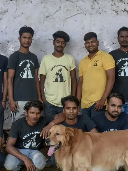 Our team photo, complete with a furry photobomber. It's hard to get a shot without one of our dogs wanting to be part of the action.