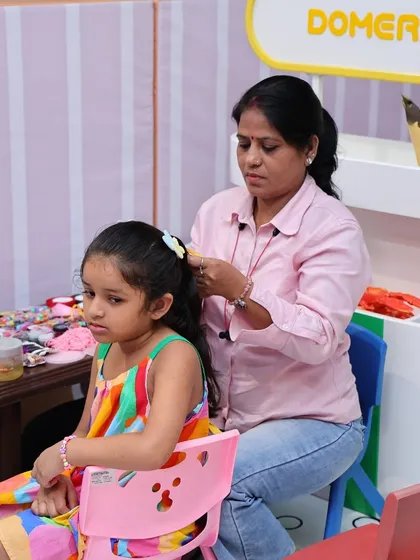 Another little guest getting her hair styled at our pampering station.