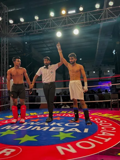 That winning feeling. My student's hand is raised by the referee after a dominant performance in his kickboxing bout.