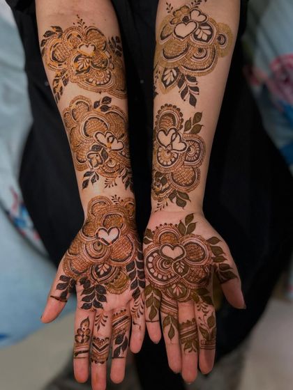 A romantic take on Arabic henna, with heart motifs cleverly integrated into the floral patterns. This is a perfect design for an engagement, anniversary, or just to celebrate love.