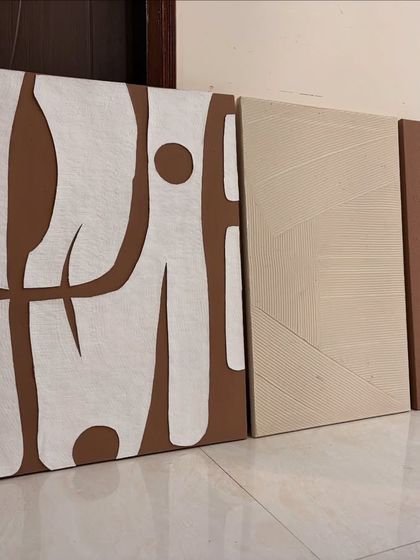 A set of three custom canvases for a client in Kolkata. The collection includes a bold abstract piece, a subtly textured canvas, and a solid color block, designed to be displayed together.