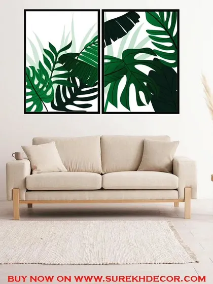 A vibrant set of two framed prints featuring lush, green fern and monstera leaves. This botanical art brings a fresh, tropical feel to any room and is perfect for plant lovers.