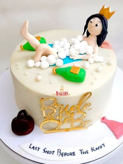 Another one of my most popular bachelorette cake designs. This fun cake features a bride-to-be relaxing in a bubble bath with champagne. It's a quirky and memorable choice for a "last shot before the knot."