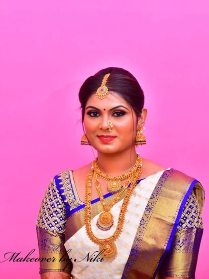 A classic portrait of a muhurtham bride. The makeup is flawless, the jewellery is traditional, and she is ready for her ceremony.