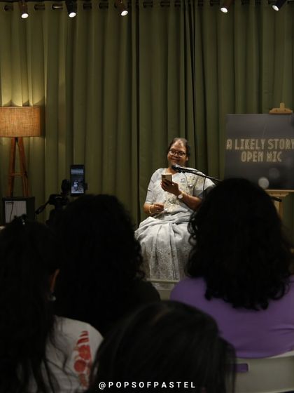 A storyteller captivates the audience during an evening show.