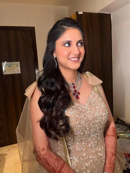 A candid moment of joy. The makeup is designed to look flawless from every angle, whether she's posing or laughing.