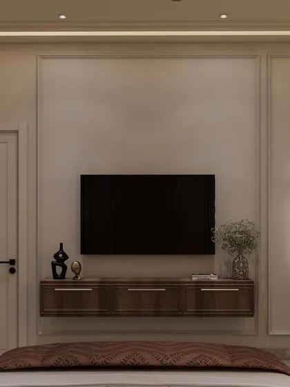 The view from the bed, showing the simple yet elegant TV wall and console. The space is designed to feel uncluttered and serene.