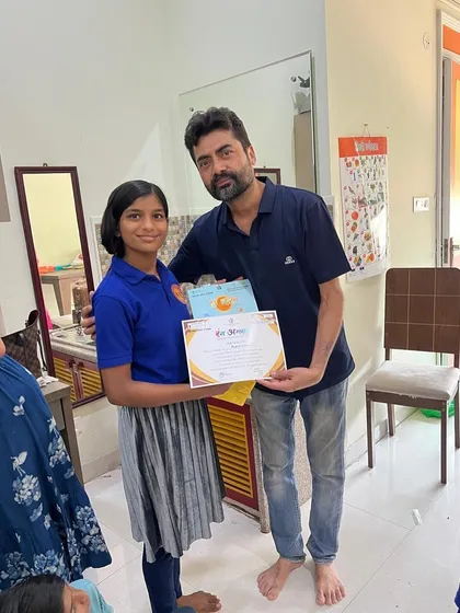 That proud smile says it all! I love celebrating each child's journey at the end of our summer camp. Here, a talented student receives her certificate of completion after a fantastic performance.