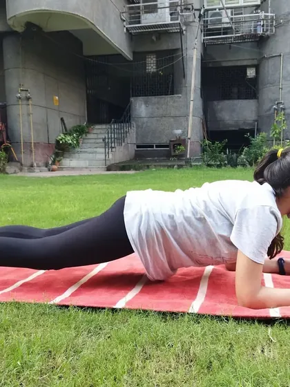 Core strength is everything. A student holds a perfect plank form during our outdoor session, building the stability needed for powerful kicks and blocks. We focus on these fundamentals in every class.
