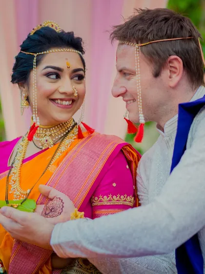 A beautiful moment between Sneha and her groom during their cross-cultural wedding ceremony.