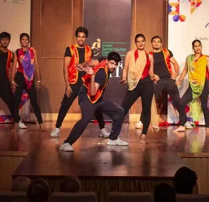 My dance troupe performing a dynamic routine on stage. We work on creating diverse choreography that keeps the audience engaged, mixing modern Bollywood steps with folk influences for a unique show.