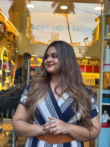 Soft waves, warm tones, and a major glow. This client is radiating confidence with her new soft blonde balayage, perfectly styled to show off the color.