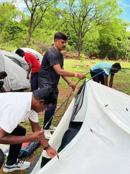 Participants learn how to pitch their own tents, a fundamental camping skill taught at our Basic Rock Climbing Course in Ramanagara.