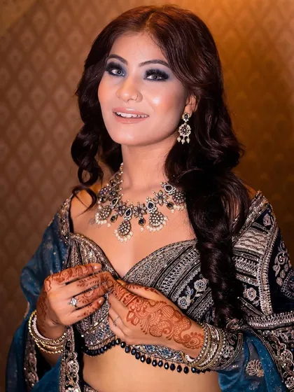 A portrait of our model rocking the midnight blue smokey eye, looking confident and chic.