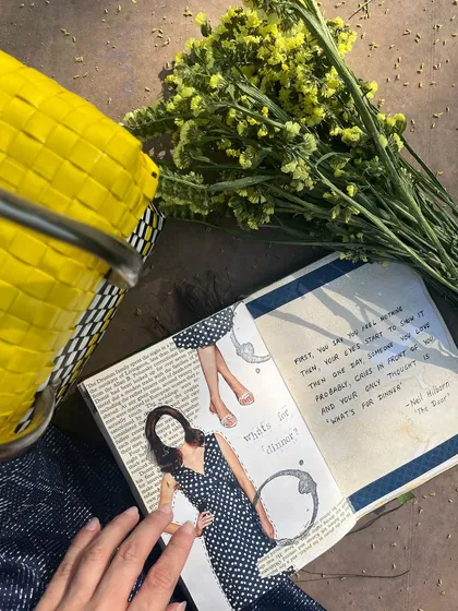 A journal spread created during a picnic in the park, featuring a collage and a quote about emotional numbness.