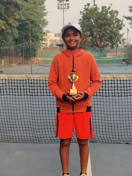 Aarav holding his doubles runner-up trophy. Every tournament provides valuable match experience for our young, aspiring champions.