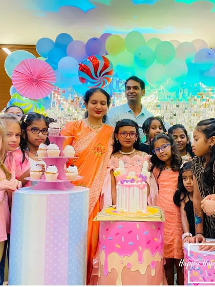 The birthday girl and her friends gathered around the cake at the Candyland party. Creating these happy, shared moments is the best part of my work.