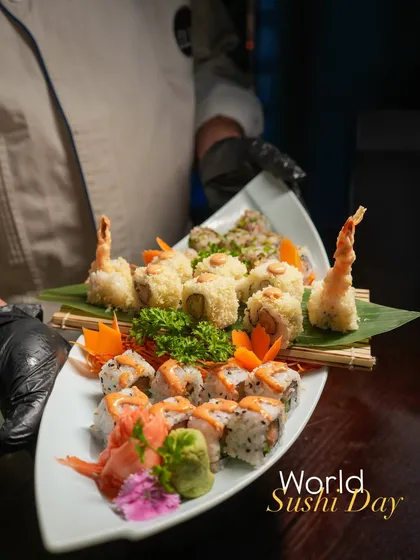 A platter celebrating World Sushi Day, featuring our popular Ebi Tempura rolls. The crispy prawns and crunchy coating make this a textural delight and a favorite for any occasion.