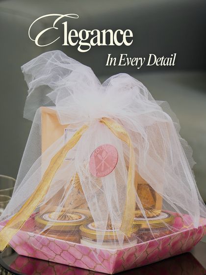 Elegance in every detail. Our hampers are finished with beautiful packaging, like this delicate tulle wrap, ensuring your gift looks as good as it tastes.