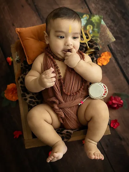 A candid shot of the baby, lost in his own little world.