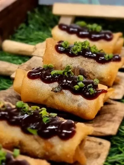 Mini spring rolls with a rich dipping sauce. A classic party snack that we elevate with high-quality ingredients and perfect execution.