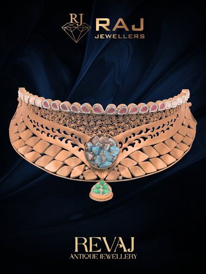 This wide Revaj choker makes a bold statement with its textured gold plates and carved details. The central turquoise-colored stone provides a striking focal point, perfect for a bride looking for a unique and powerful design.