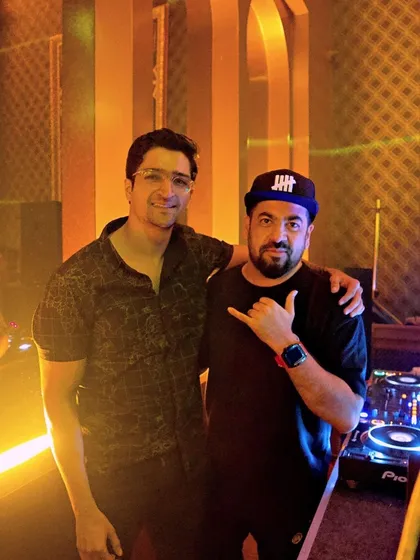 Posing with a guest at the DJ booth.