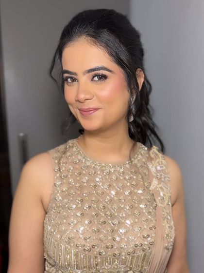 Our "Indian Barbie" look, perfect for a cocktail or reception. The makeup is soft and pretty, with a focus on flawless skin and shimmering eyes, paired with an elegant updo.