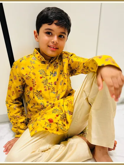 Another happy client looking dapper in a bright yellow floral kurta. Our printed kurtas are perfect for adding a pop of color to any festive occasion.