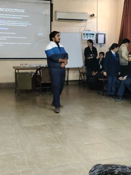 An instructor at Lions Public School leads an introductory session for a robotics workshop. We always begin by explaining the core concepts before diving into hands-on activities.