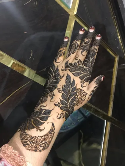 Another angle of the full-hand leaf design. It's a statement piece that covers the hand in a very modern way.