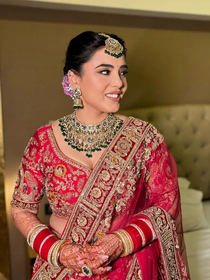 A lovely profile shot of Diksha. We added a floral touch to her hair, which complemented the soft glam makeup.