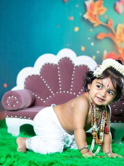 This little Krishna is crawling and ready for some fun and mischief.