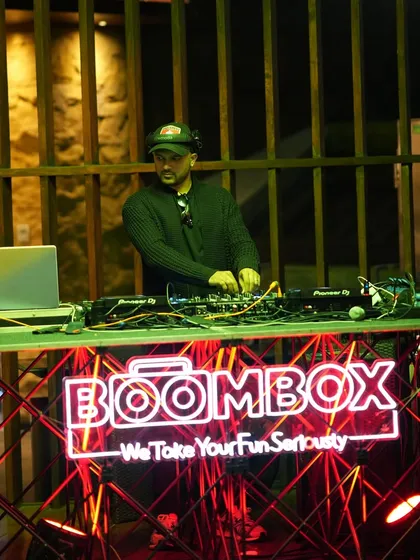 I also provide the entertainment for exclusive corporate and private events. Here's my DJ setup, complete with our neon logo, at the elegant closing party for the Bangalore Polo Season.