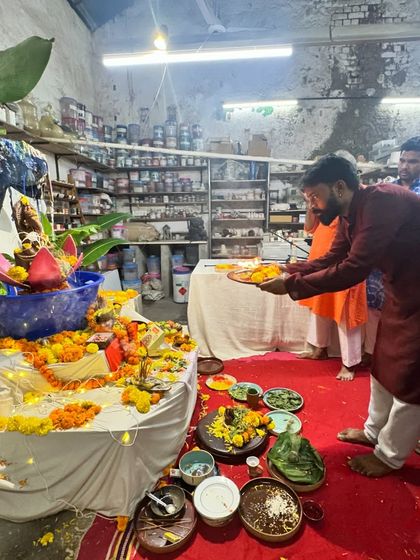 The aarti ceremony continues with another member leading the prayer. The entire studio joins in, creating a powerful and unified devotional experience.