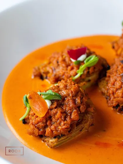 A detailed shot of the Achari Artichoke with Spicy Soya Keema, showcasing the texture of the mince and the vibrant colour of the sauce.
